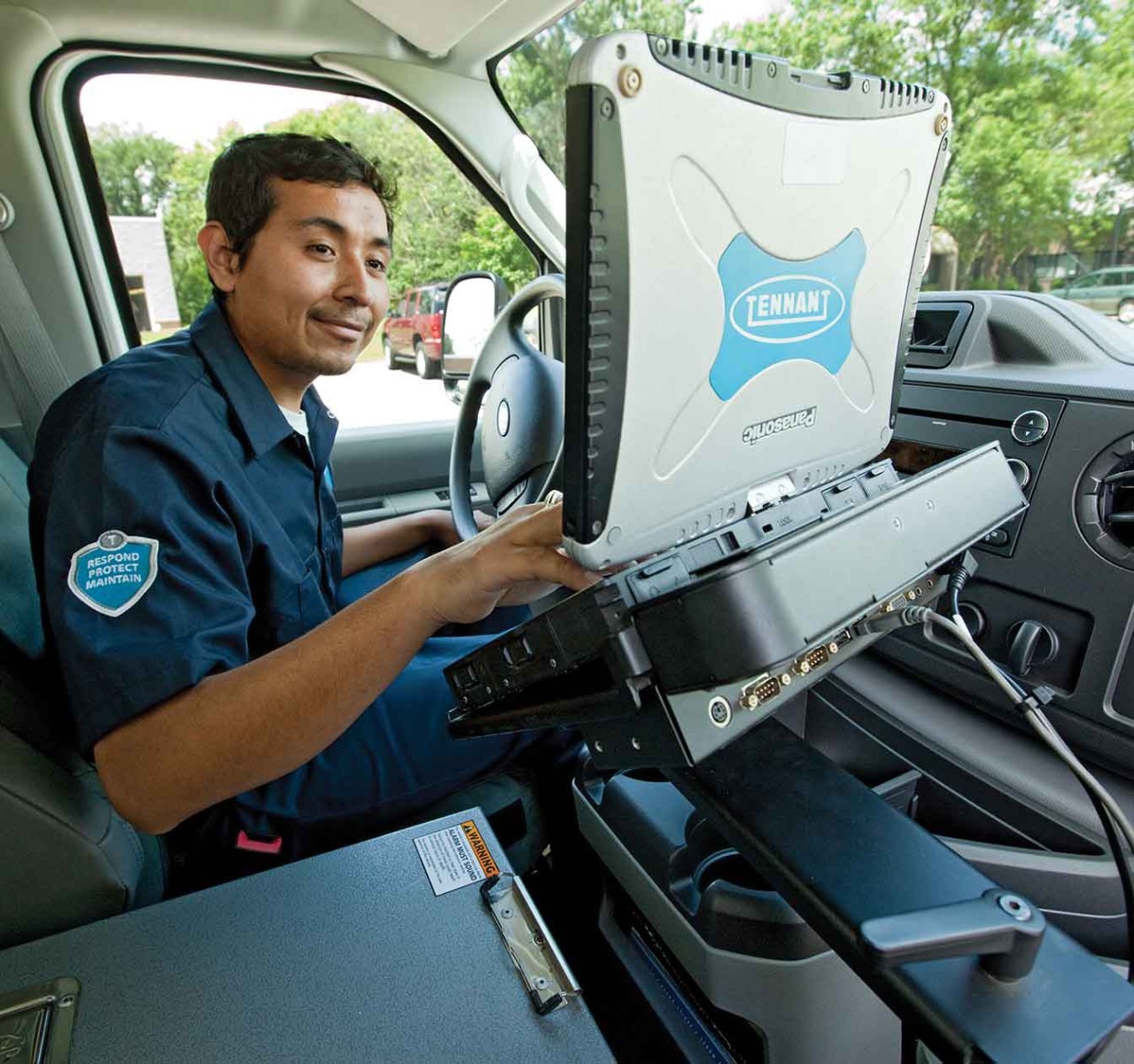 Tennant Service Team member in van