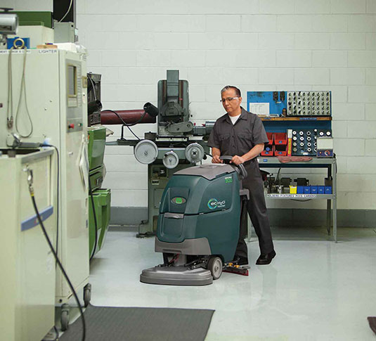 Tennant machine cleaning a facility Tennant machine cleaning a facility
