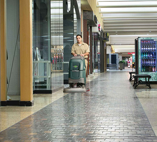 Cleaning professional using a Nobles Speed Scrub 300 Cleaning professional using a Nobles Speed Scrub 300